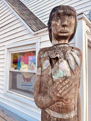 Old wooden statue holding ice cream cone - Dairy Delite