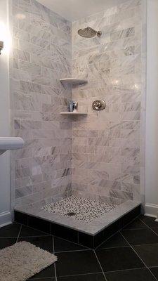 Bathroom renovation with marble tile and slate flooring