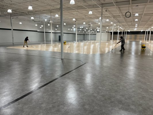 Two Palmetto Services employees cleaning and waxing the floors at the new Dick's in Bel Air, MD!