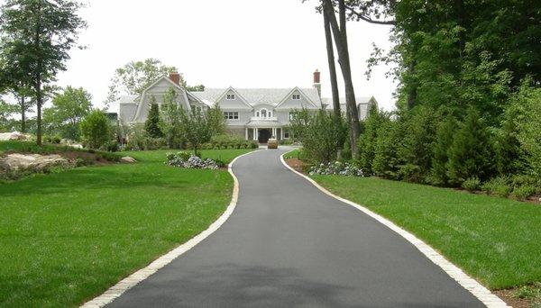 A Paved Asphalt Driveway in Darien, CT with Belgium block curbing and a gutter.