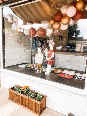 Decorated front left window for the opening