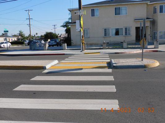 The cross walks with no signs of the overhead lights that helps kids see cars and the crosswalk.