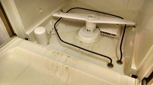 This is the photo of a dishwasher Scott Properties (The Oasis) refuses to fix. This dishwasher can't even clean itself!