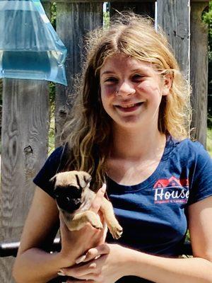 One of our four daughters. This one is Raegan and she's holding the mascot.