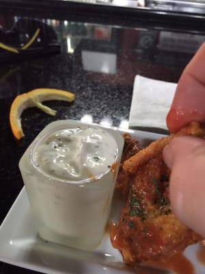 Hard to dip chicken wings in a narrow, deep shot glass.