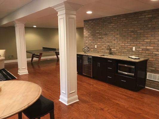 Wet bar area with brick accent wall.....