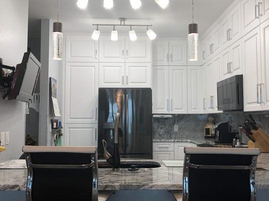 Add stacked cabinets to a small condo kitchen to add extra storage