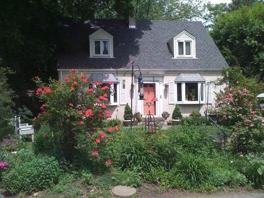 Park in front & walk around the L side of the house to the back door.