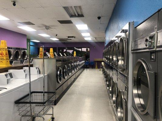 Galley shot of the back of the laundromat lookin to the front.