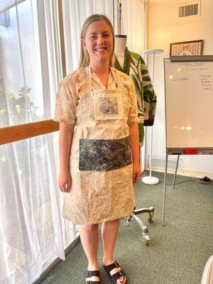 Showing off her custom made apron she learned in our Stitch x Stitch class!