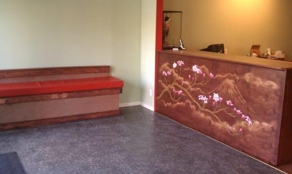 Waiting area and hand-painted counter.