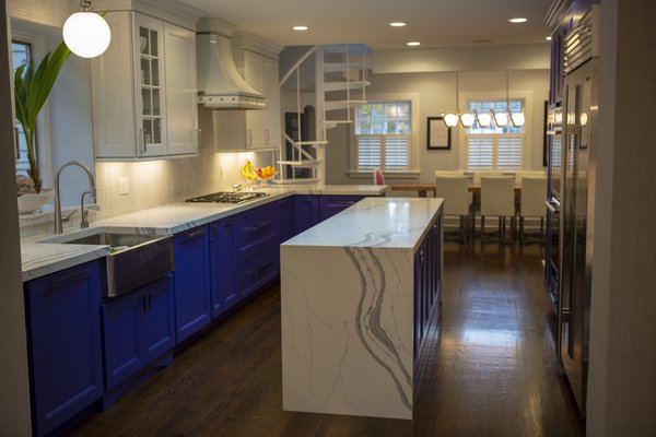 Custom colors base with white uppers and quartz waterfall countertops