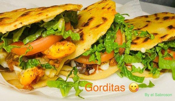 Gorditas Served with refried beans, melted cheese and your favorite meat, lettuce and tomatoes)