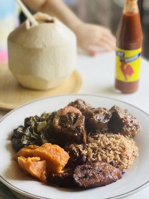 Oxtail dinner and sides plated at home.