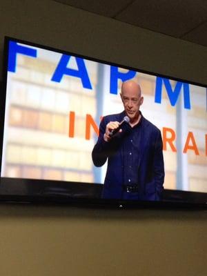 Professor Burke speaking at an employee meeting