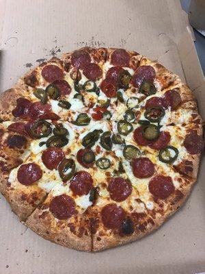 Large pepperoni and jalapeño pizza