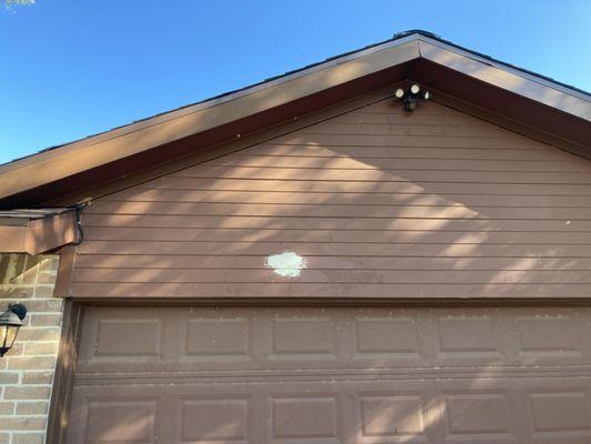 This is what the front of my house looked like after Mason Trees punched a huge hole in my house and trying to patch it themselves.