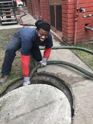 hard at work taking care of lint trap with 300 lb lid