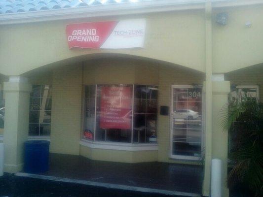 Front Store w/ Grand Opening Sign