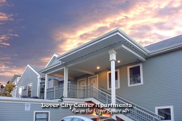 Back of building view of entry to one and two bedroom apartments at Dover City Center Apartments on the Upper Square