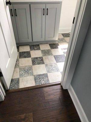 What a fun laundry room floor done in luxury vinyl tiles.