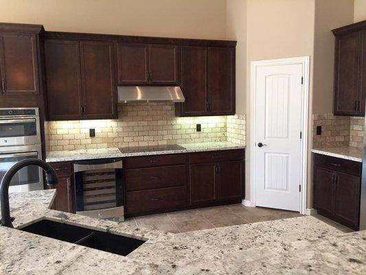 Custom back splash and flooring tiles by LTD at a custom home in LHC.