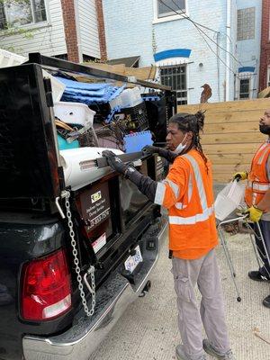 Workers filling up dump truck