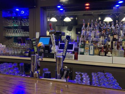 DRAFT BEERS, LOTTO, AND PREMIUM LIQUORS ON DISPLAY.