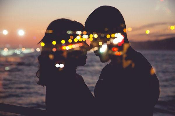 Santa Monica lights behind a gorgeous engagement silhouette