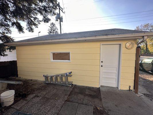 After a thorough pressure washing, many repairs and some new trim installed this garage came back to life.