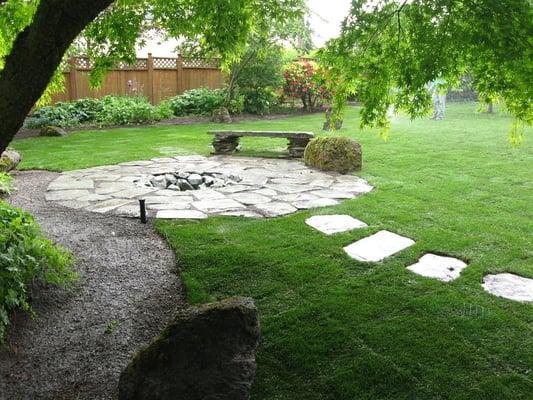 New Sod with flagstone patio/ fire pit