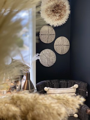 African Juju hats and handcrafted wooden shields.