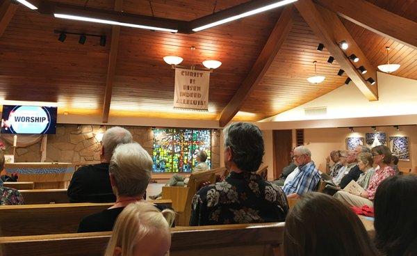 Members and friends attending church