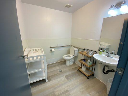 Bathroom with a changing table for your little ones!