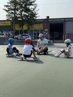 Alfredo with the skateboard students