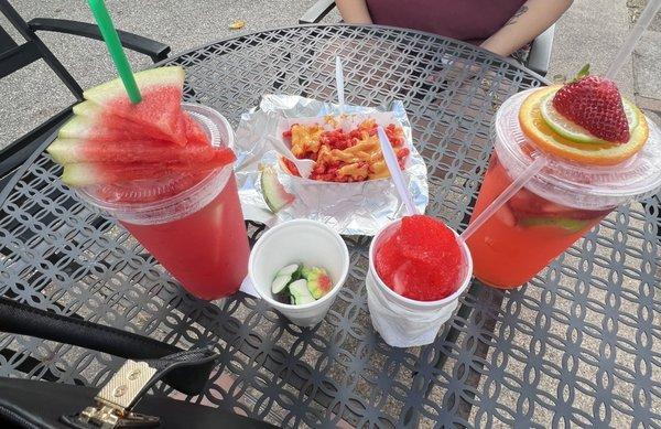 Watermelon Agua, Strawberry Limeade Agua, Cherry Snowie, and Hot Cheeto tray