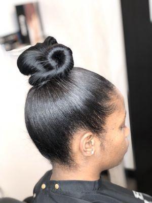 Sleek Ponytail done on natural hair.