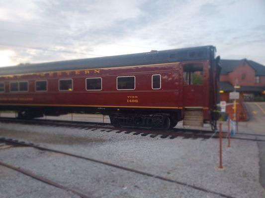 An antique train car at the station.