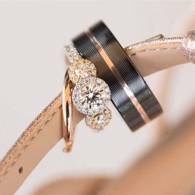 Rose Gold Wedding Ring Set with Hearts On Fire three stone halo engagement ring and Lashbrook Groom's Band.