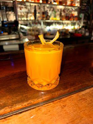 Firefly Martini  Canyon Diablo gin infused w/ turmeric, lime juice, honey syrup, finished with black peppercorn tincture