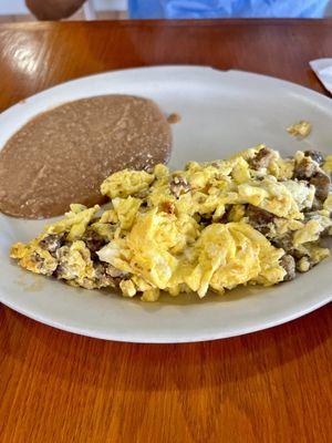 American breakfast plate - Sausage, eggs and refried beans