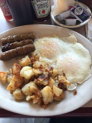 Breakfast Platter ($7.99) 2 eggs any style (over-medium shown), home fries, meat (sausage links shown), and toast (none shown)