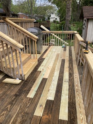 This is the deck that is after the replaced boards, new stairs, and railings.  I then stained it.