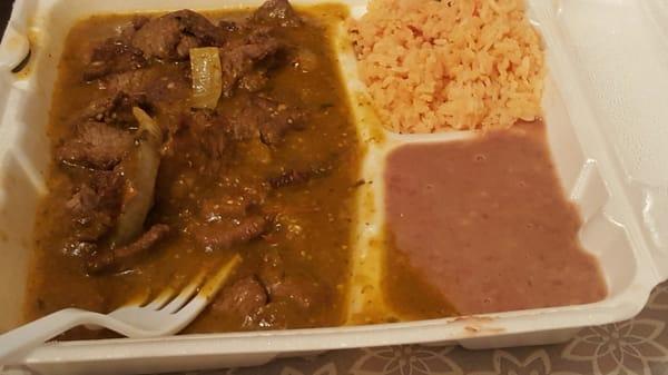 Bisteak Ranchero with Rice & Beans...Tomatillo sauce is not hot & spicy but just Perfect!