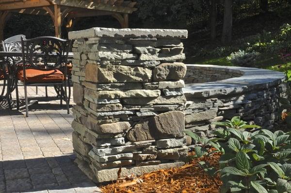 traditionally laid drystone outdoor wall seat feature 
materials-bluestone