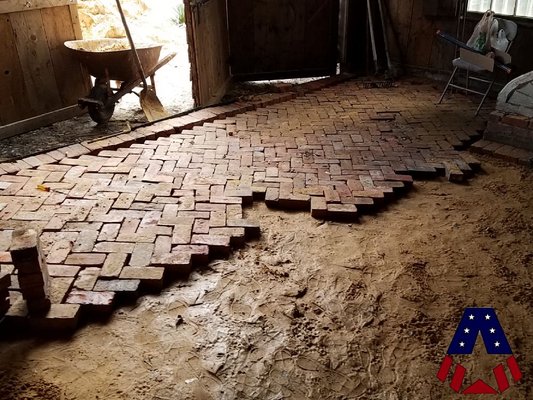 Herringbone brick floor in progress