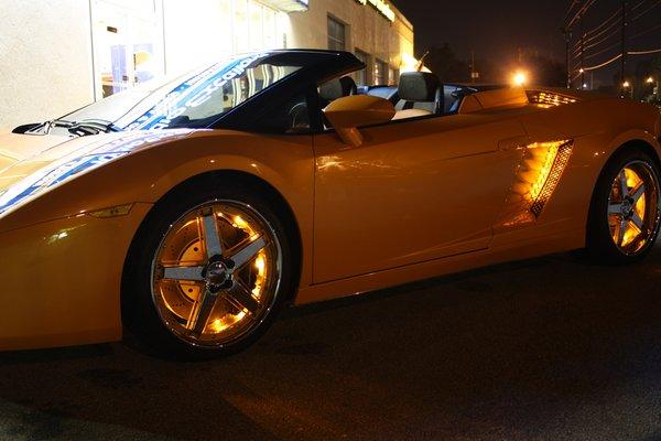 Custom lighting package on an Orange Ferrari.