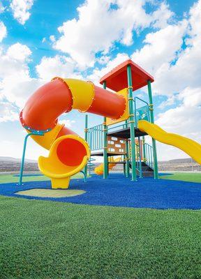 Kids love the extra padding that comes with synthetic grass playgrounds.