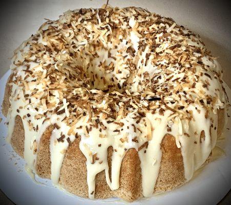 Coconut Cream Pound Cake topped w/ toasted coconut shavings