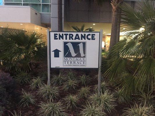 Entrance sign tucked away near the coliseum box office